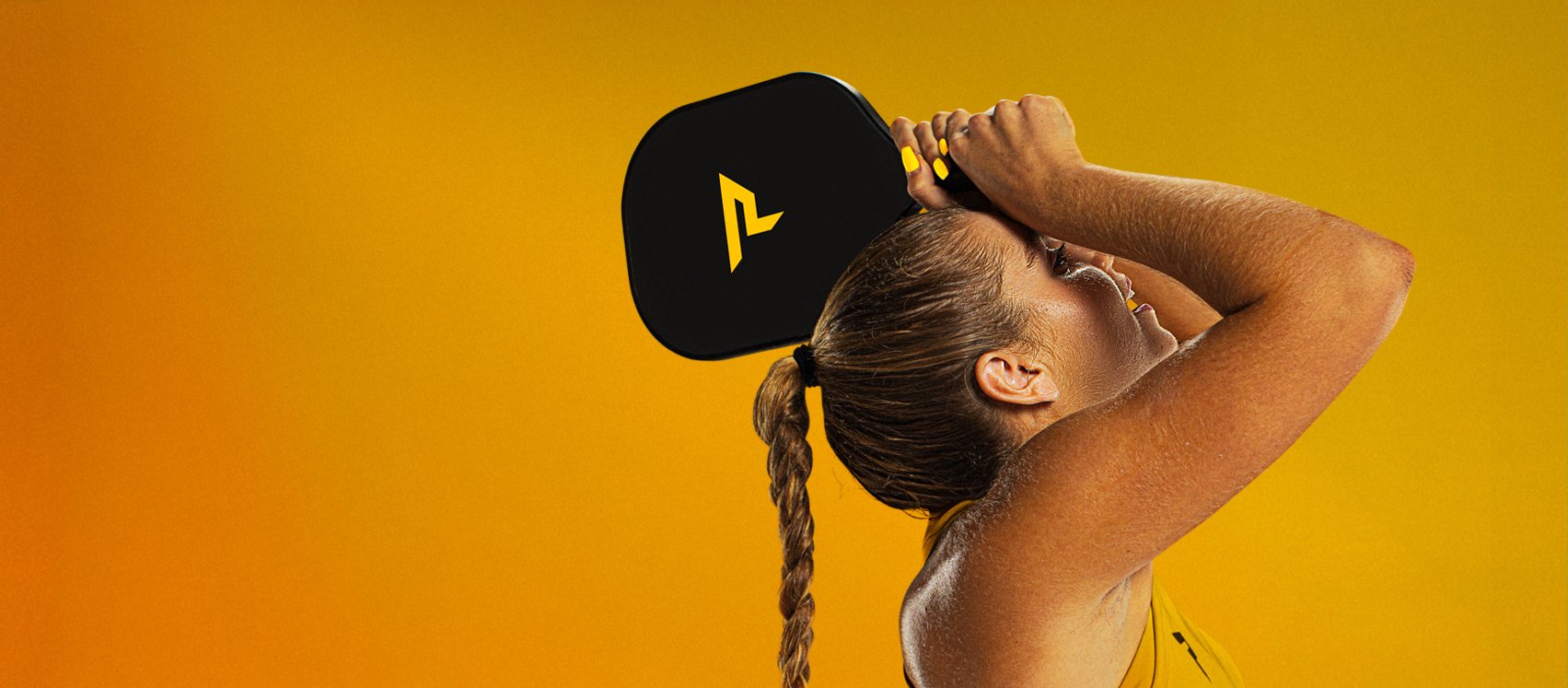 Player holding Bantam Series paddle from Paddletek